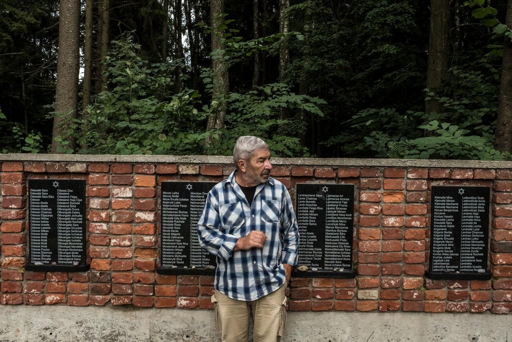 Eugenijus Bunka, the son of a prewar Jewish resident of Plunge who fled to the Soviet Union, at a Holocaust memorial.CreditBrendan Hoffman for The New York Times