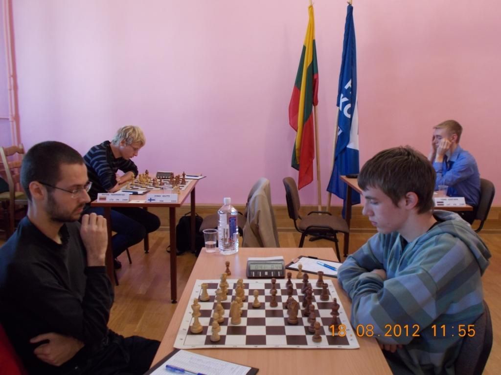 Слева победитель турнира мастеров Эмилис Пилецкис.