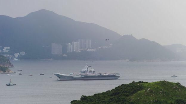 AFP Image caption Авианосец "Ляонин" был принят в состав военно-морских сил КНР в 2012 году