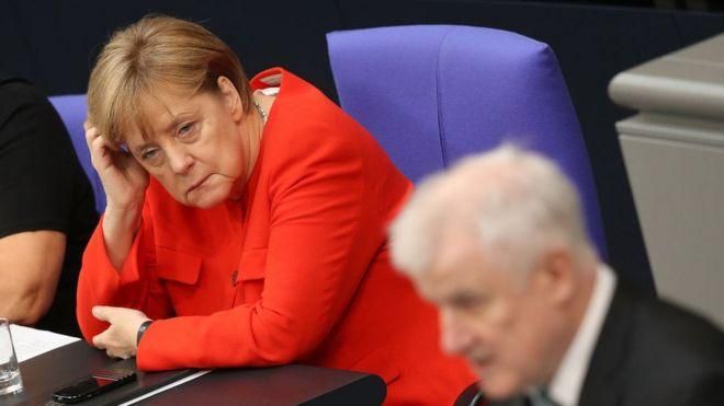GETTY IMAGES Image caption Неудача ХСС в Баварии может дорого обойтись лидеру ХДС Ангеле Меркель