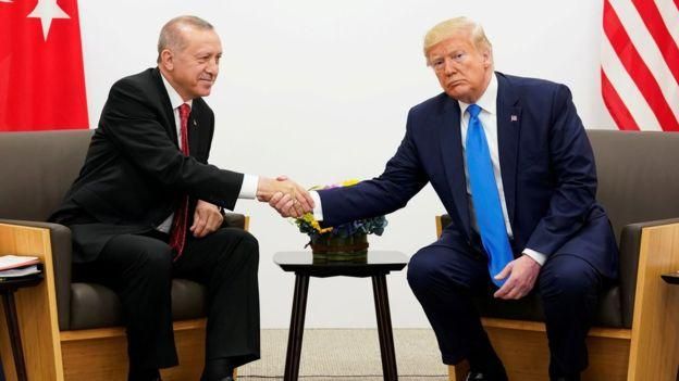 REUTERS Image caption Эрдоган и Трамп согласны с тем, что на севере Сирии должна быть создана безопасная зона